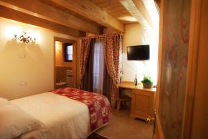 Postel nebo postele na pokoji v ubytování Garnì Astoria Hotel & SPA