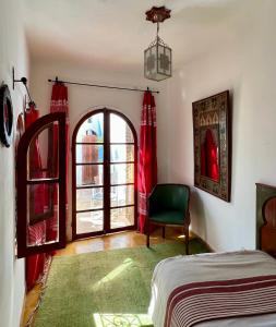 Кровать или кровати в номере RIAD OASIS D'ASILAH