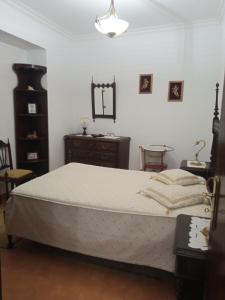 Postel nebo postele na pokoji v ubytování Casa das Festas