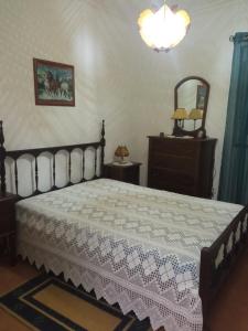 Postel nebo postele na pokoji v ubytování Casa das Festas