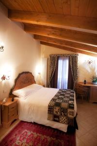 Postel nebo postele na pokoji v ubytování Garnì Astoria Hotel & SPA