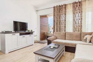 a living room with a couch and a tv at Minka in Kotor