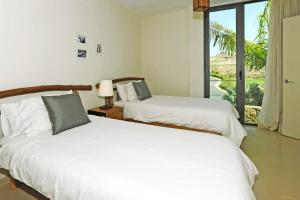 Ένα ή περισσότερα κρεβάτια σε δωμάτιο στο Salobre Los Lagos 10 +70 φωτογραφίες