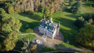 an aerial view of a large castle in a field at Château Laverdines in Baugy