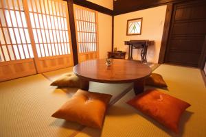 a room with a table and pillows in a room at Aburaya Bettei - Vacation STAY 50810v in Beppu