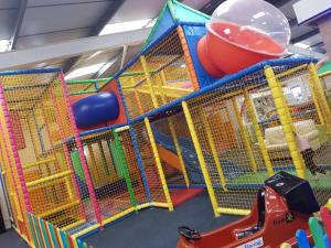 a play room with a playground with play equipment at D19 in Aberystwyth