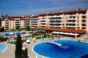 a view of a resort with a large swimming pool at Royal Sun Holiday Apartments in Sunny Beach