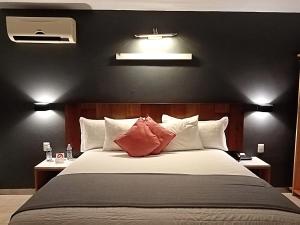 A bed or beds in a room at Hotel CLARUM 101