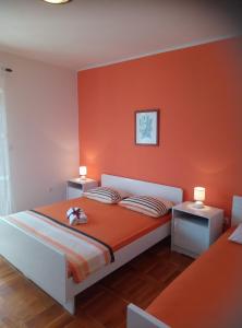Postel nebo postele na pokoji v ubytování Apartments Dalmatia