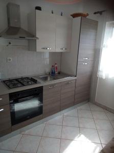Kuchyň nebo kuchyňský kout v ubytování Apartments Dalmatia
