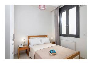 Postel nebo postele na pokoji v ubytování Casa di Ariadne