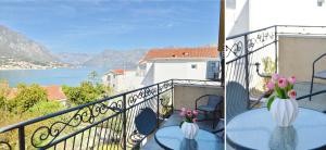 a balcony with two tables and a view of the water at Apartments Jovanovic - Alkima in Kotor