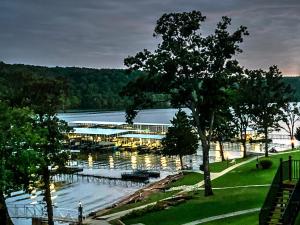 a view of a marina with boats in the water at Peaceful 1st floor lakeside condo minutes from Osage Beach and Ozark State Park in Kaiser