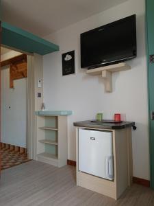 a living room with a flat screen tv on the wall at da Dorian room plus apartments in Punat