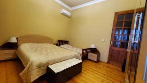Postel nebo postele na pokoji v ubytování Guest House Lazika