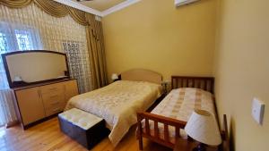 Postel nebo postele na pokoji v ubytování Guest House Lazika