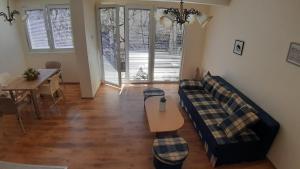 a living room with a couch and a table at Apartment V in Ohrid