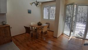 a dining room with a table and chairs at Apartment V in Ohrid +24 photos