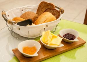 a basket of bread and other ingredients on a table at Spreewald Pension Am Spreeschlößchen in Lübbenau