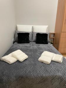 Postel nebo postele na pokoji v ubytování Nemeapolis 2 apt