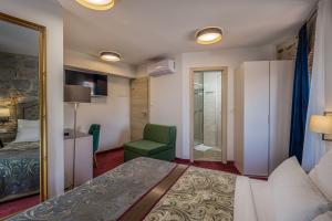 Uma cama ou camas num quarto em Hotel Agava Split
