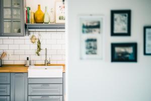 a kitchen with a sink and a counter at BELAKAPA Authentic house with garden and free parking in Ilirska Bistrica +37 photos