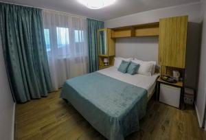 Кровать или кровати в номере Hotel Sunset Beach Vama Veche
