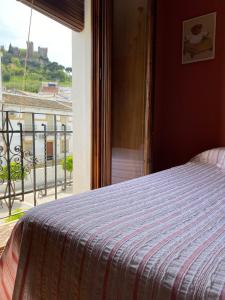 Casa Rural Mirador del Castillo tesisinde bir odada yatak veya yataklar