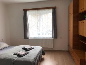 Postel nebo postele na pokoji v ubytování Apartmány Jevany