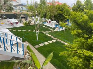 a yard with a playground with at Hotel Antonio in Çeşme