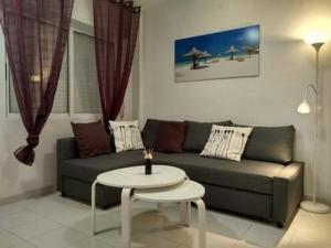 Posedenie v ubytovaní Apartament Naranja con piscina urb El Paraiso