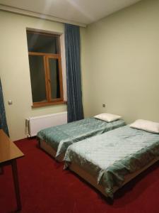 Posteľ alebo postele v izbe v ubytovaní Hostel One