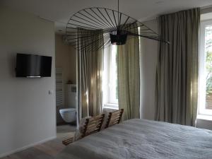 Postel nebo postele na pokoji v ubytování B&B Les Tilleuls