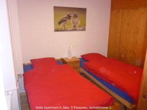 Postel nebo postele na pokoji v ubytování Nolla Apartment + 21 fotografií