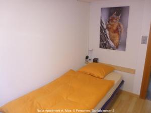 Nolla Apartment tesisinde bir odada yatak veya yataklar