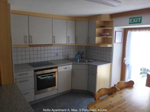 Η κουζίνα ή μικρή κουζίνα στο Nolla Apartment