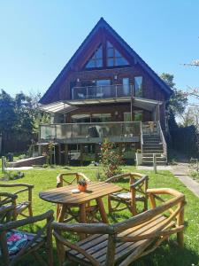 a wooden table in front of a house at Apartment Seascape - Self Check-In in Duisburg