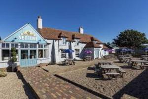 a restaurant with picnic tables in front of it at Family Fun 2-Bed caravan family romney Marsh in Burmarsh