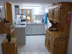 Η κουζίνα ή μικρή κουζίνα στο Nolla Apartment