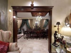 a dining room with a dining table and a dining roomiasm at Petra Villa in Wadi Musa