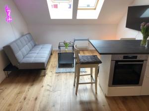 a living room with a couch and a table at Lendhafen in Klagenfurt