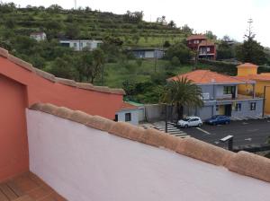 a view from the balcony of a house with a parking lot at Pequeño Estudio Pinar 2 in Puntagorda