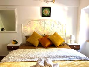 a bedroom with a large bed with two pairs of shoes on it at HealthyStudio512 Apartments in Kotor