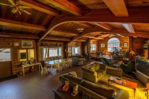 a living room with couches and chairs in a building at Alert Bay Lodge in Alert Bay