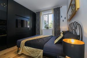 Posteľ alebo postele v izbe v ubytovaní FRAMAR apartment