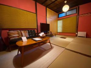 a living room with a couch and a table at TATAMI l in Yokohama
