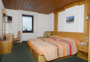 Ένα ή περισσότερα κρεβάτια σε δωμάτιο στο Savoia Hotel