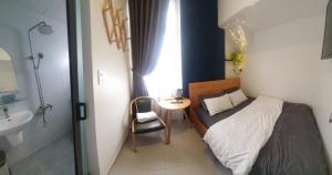 Postel nebo postele na pokoji v ubytování Hello Dalat Hostel