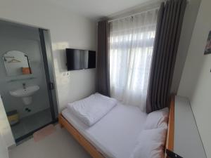 Postel nebo postele na pokoji v ubytování Hello Dalat Hostel