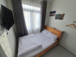Postel nebo postele na pokoji v ubytování Hello Dalat Hostel